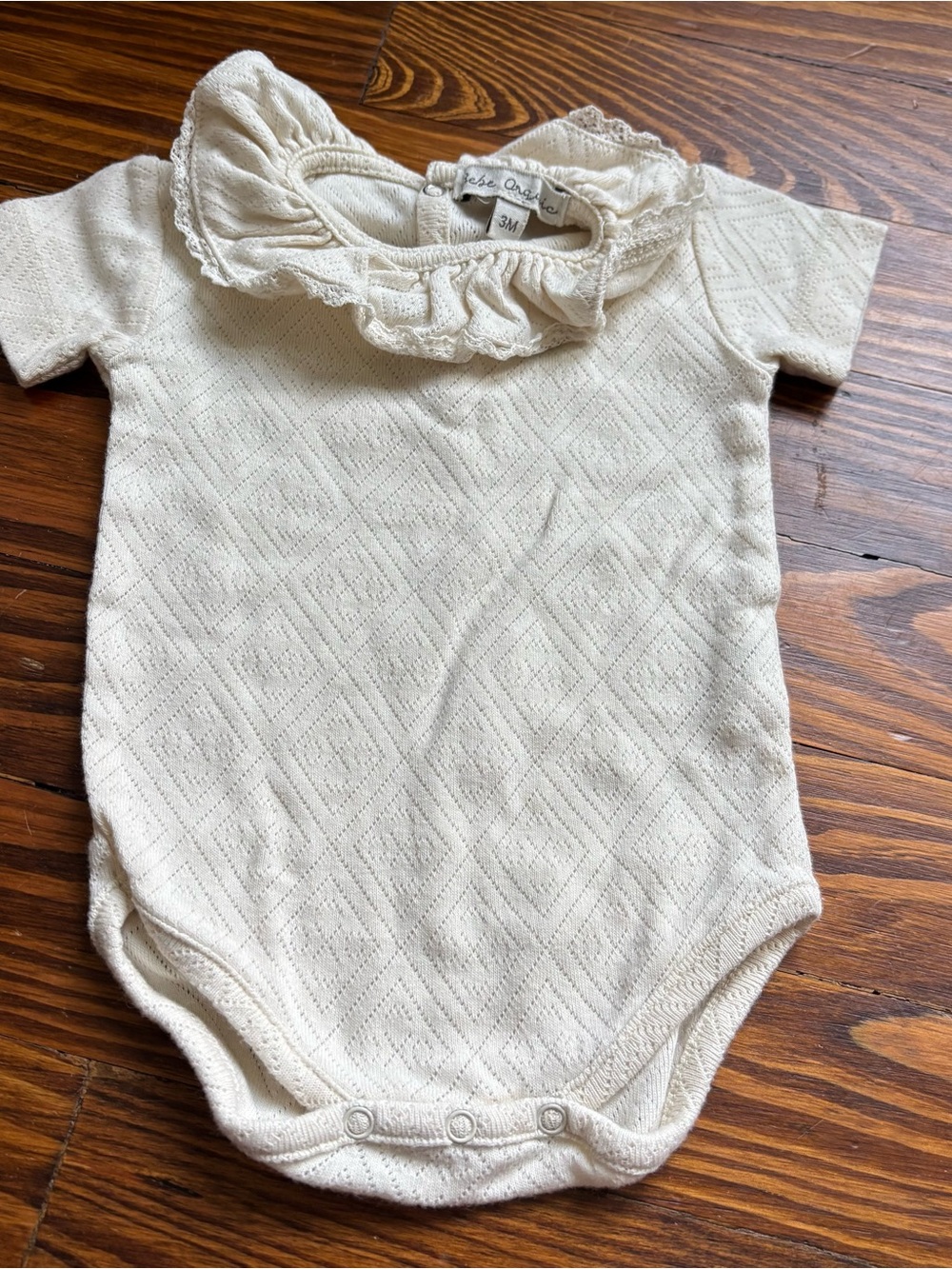 Bebe Organic Cream Ruffle Collar Baby pointelle One-Piece Bodysuit